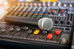 microphone-audio-sound-mixer-analog-sound-control-room-blurred-background_185126-1253-2.webp